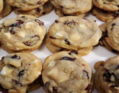 stacks of cookies with white chocolate chips and dried cranberries